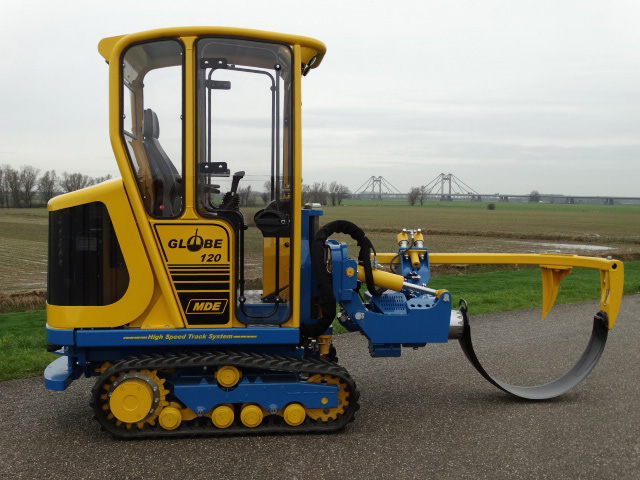 Specialized digging machinery used in plant nurseries for efficient soil preparation.